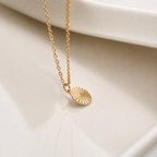 Maggie gold sunburst radiant disc pendant necklace