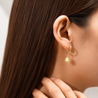 Reagan gold sunburst star dangle huggie hoop earrings