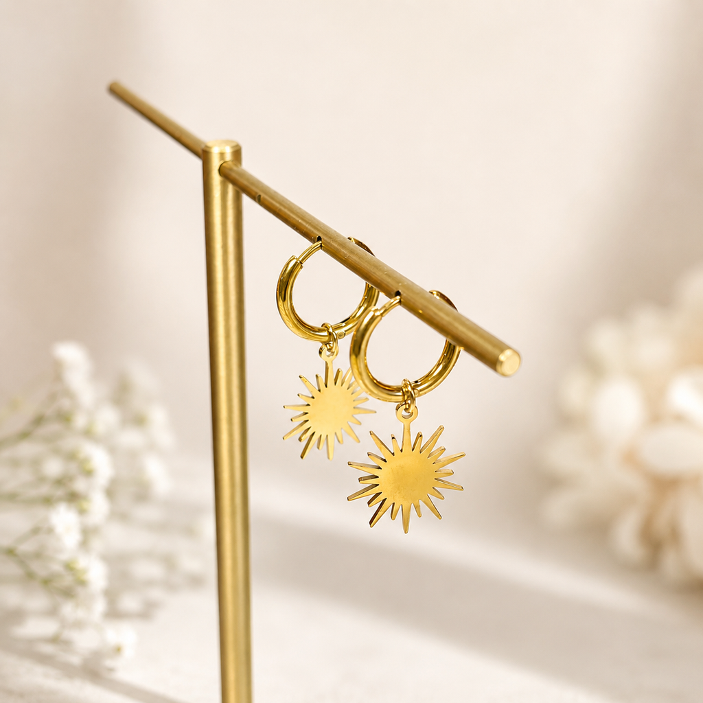 Reagan gold sunburst star dangle huggie hoop earrings